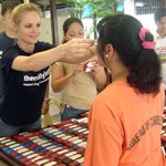 _thumbnail_Debbie_assisting_an_inmate_with_her_new_eyeglasses_Philippines_.jpg